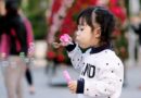 kid playing with bubbles